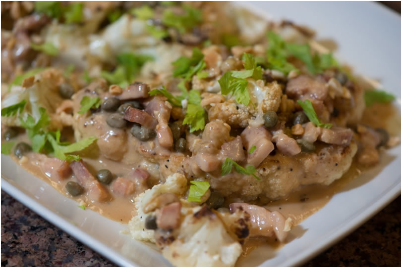 Cauliflower “Steaks” with Peanuts, Bacon and Capers